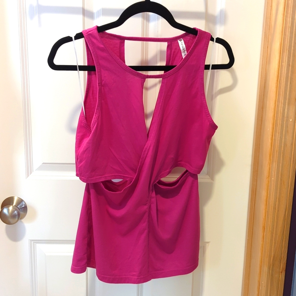 Berry pink side cutout Fabletics workout top.